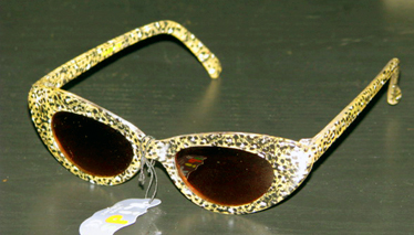 Girl's yellow and black sunglasses.
