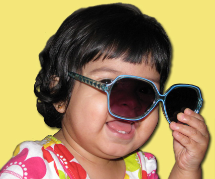Child with kids aqua blue sunglasses.